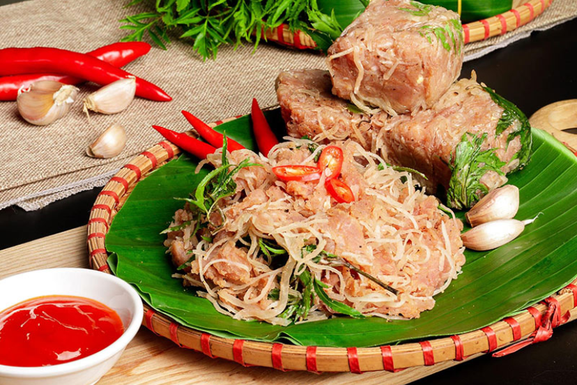 Nem Phung fermented pork mix wrapped in banana leaves, Northern village specialty